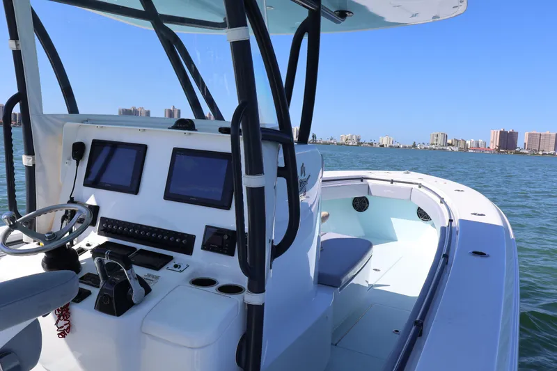 Slide: The Image of 2017 Contender 35 ST boat dashboard with city skyline in the background. - 12
