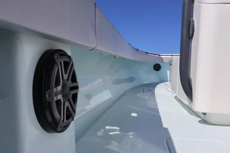 Slide: The Image of 2017 Contender 35 ST boat interior with speaker, sleek design, and blue sky background. - 16