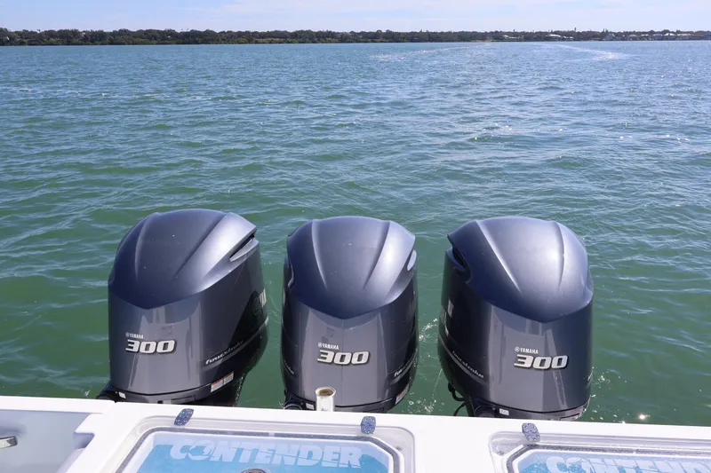 Slide: The Image of 2017 Contender 35 ST with triple Yamaha 300 engines on open water. - 6