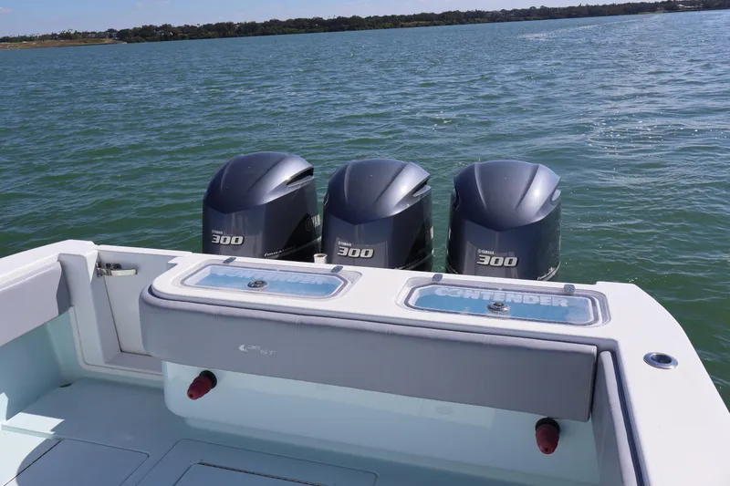 Slide: The Image of 2017 Contender 35 ST boat with triple Yamaha 300 engines on open water. - 7