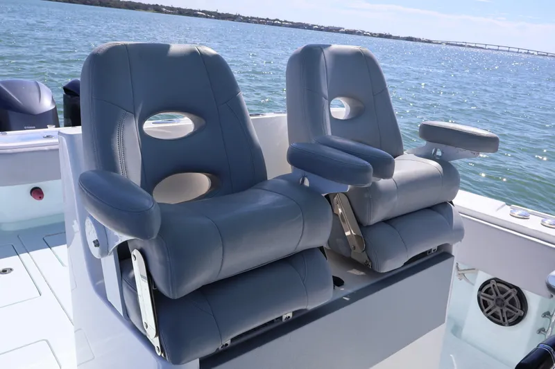 Slide: The Image of 2017 Contender 35 ST boat with dual cushioned seats on deck, ocean view. - 10