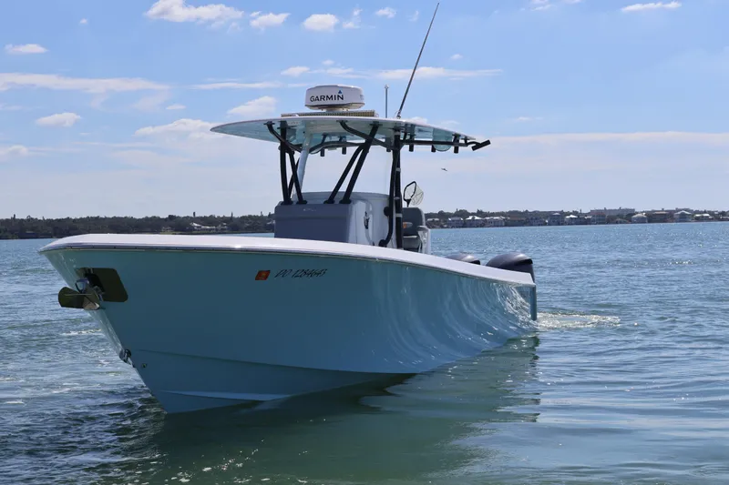 Slide: The Image of 2017 Contender 35 ST boat on calm water, featuring Garmin equipment. - 3