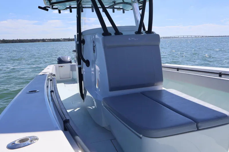 Slide: The Image of 2017 Contender 35 ST boat on water, featuring sleek seating and open deck. - 4