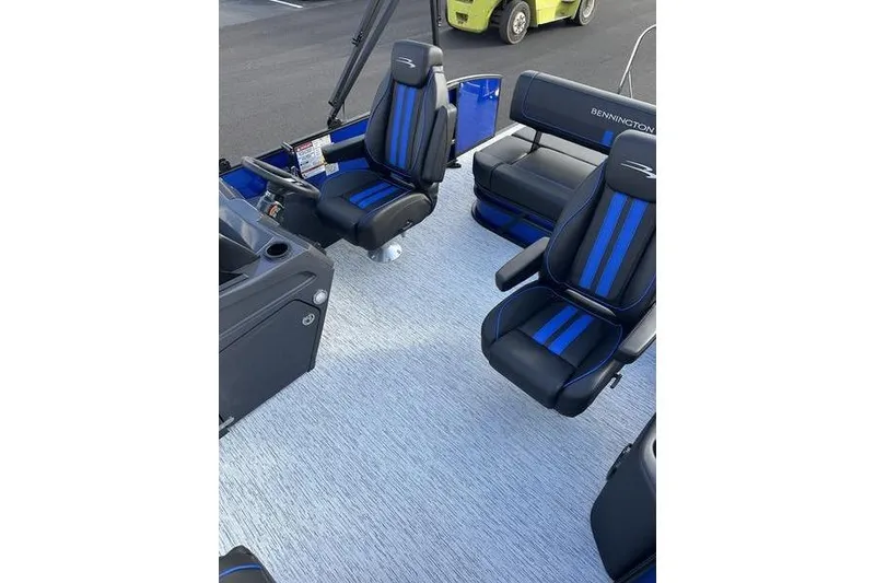 Slide: The Image of 2026 Bennington S Swingback 22 SSB interior with blue and black seating. - 10