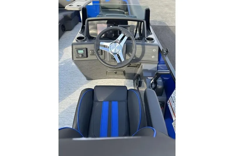 Slide: The Image of 2026 Bennington S Swingback 22 SSB boat interior with steering wheel and seating. - 11