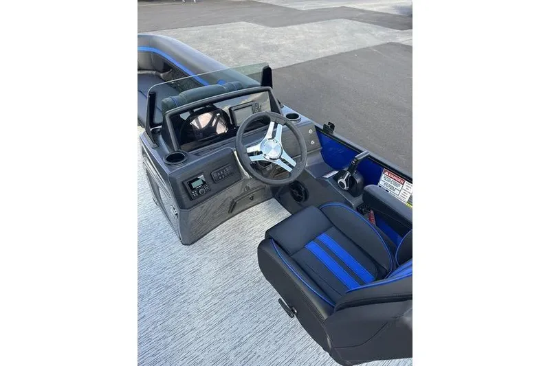 Slide: The Image of 2026 Bennington S Swingback 22 SSB boat interior with steering wheel and seating. - 12