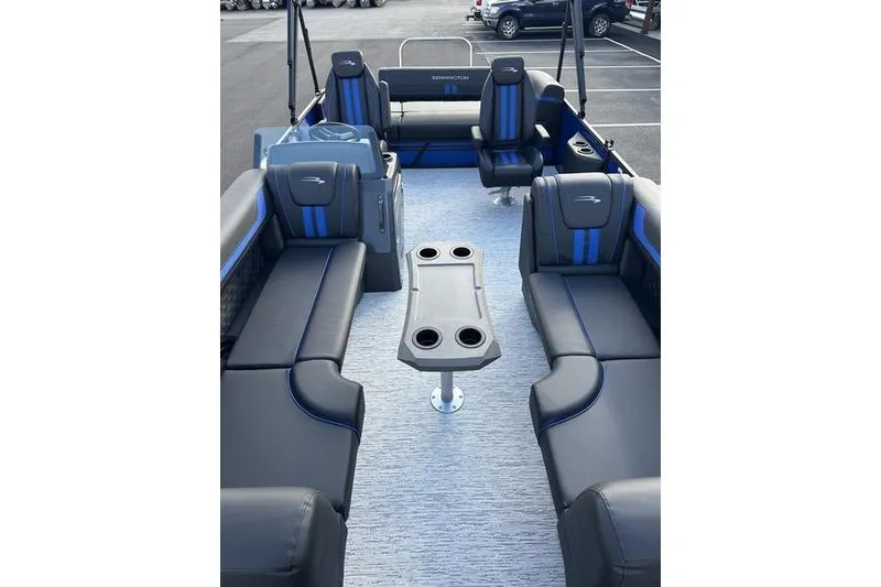 Slide: The Image of 2026 Bennington S Swingback 22 SSB pontoon boat interior with luxurious seating and table. - 13