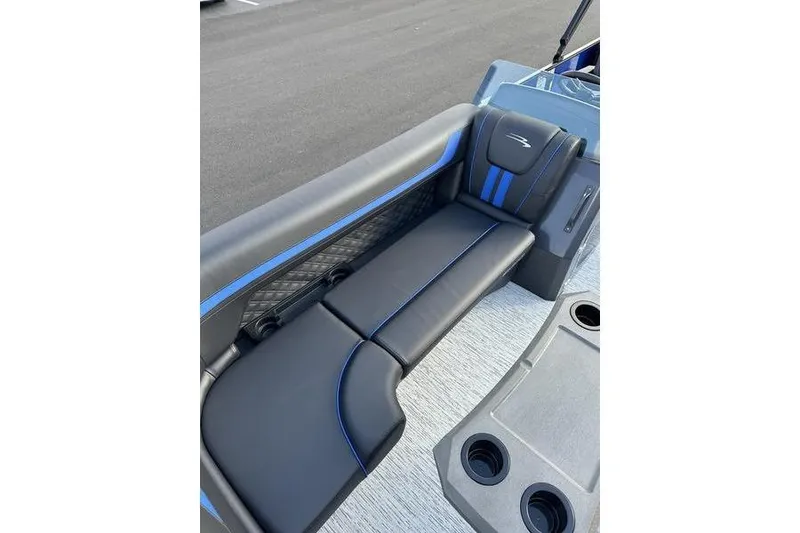 Slide: The Image of 2026 Bennington S Swingback 22 SSB boat interior with sleek black and blue seating. - 15