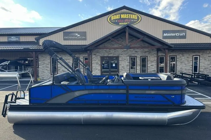 Slide: The Image of 2026 Bennington S Swingback 22 SSB pontoon boat displayed at dealership. - 3