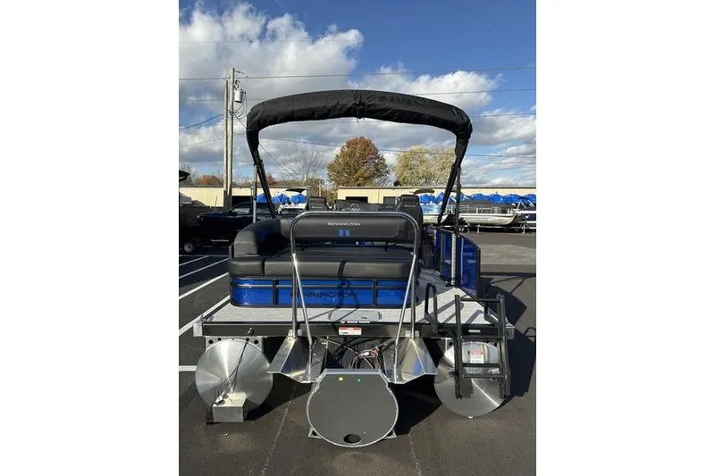 Slide: The Image of 2026 Bennington S Swingback 22 SSB pontoon boat, rear view, parked outdoors. - 8