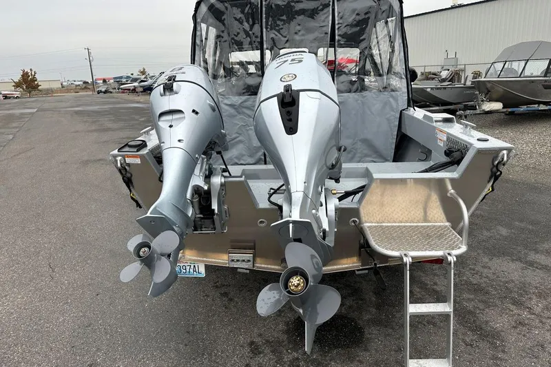 Slide: The Image of 2025 Hewescraft 160 Sportsman boat with dual outboard motors, rear view. - 4