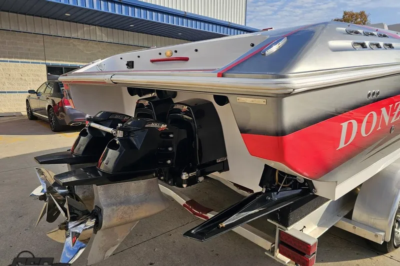 Slide: The Image of 2008 Donzi 38 ZR boat with dual engines and sleek design, parked on a trailer. - 10