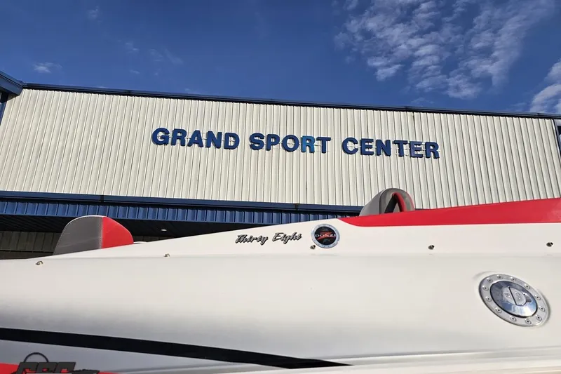 Slide: The Image of 2008 Donzi 38 ZR boat at Grand Sport Center under blue sky. - 11