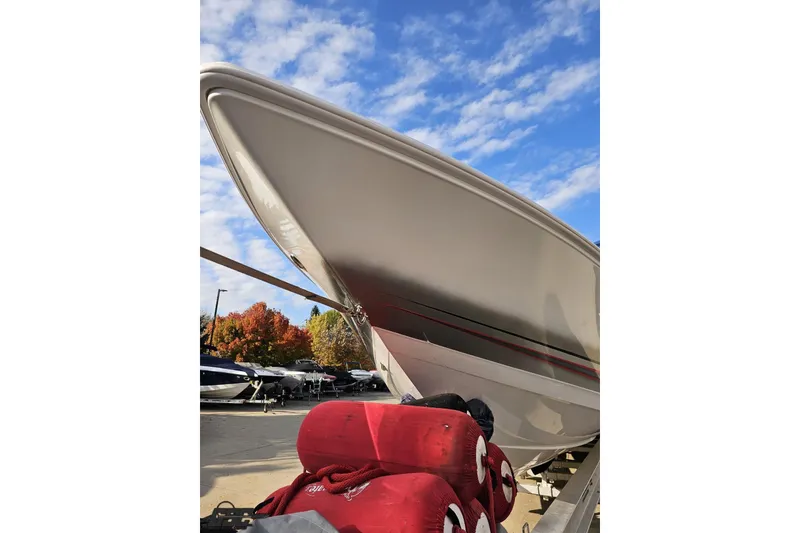 Slide: The Image of 2008 Donzi 38 ZR boat on trailer under blue sky, autumn trees in background. - 16