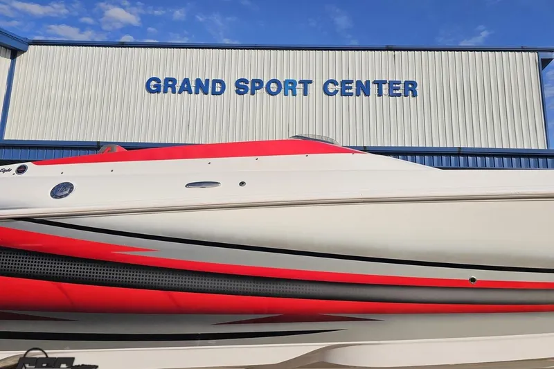 Slide: The Image of 2008 Donzi 38 ZR boat at Grand Sport Center, featuring sleek red and white design. - 3