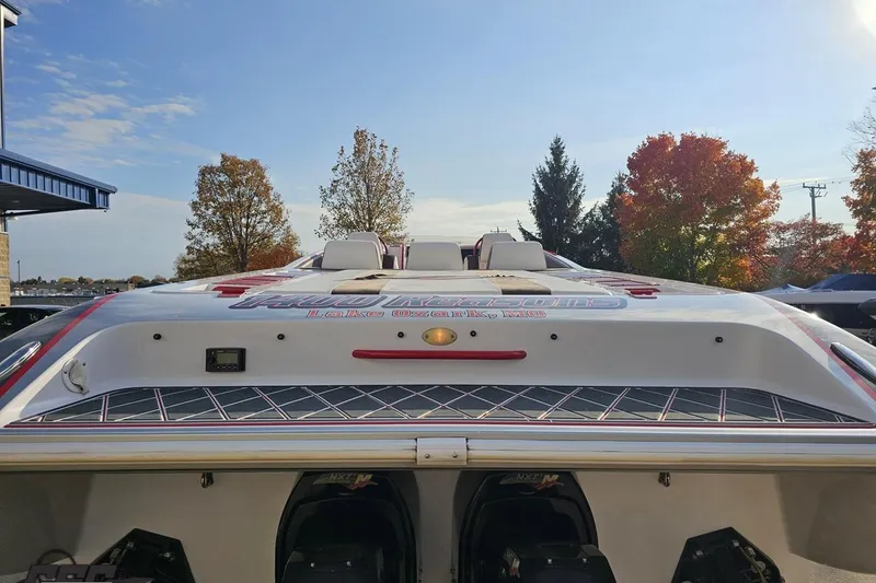 Slide: The Image of 2008 Donzi 38 ZR speedboat with custom graphics, parked outdoors on a sunny day. - 30