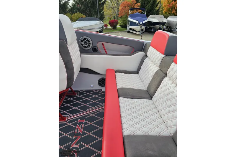 Slide: The Image of 2008 Donzi 38 ZR boat interior with red and gray seating, diamond stitching, and speaker system. - 41