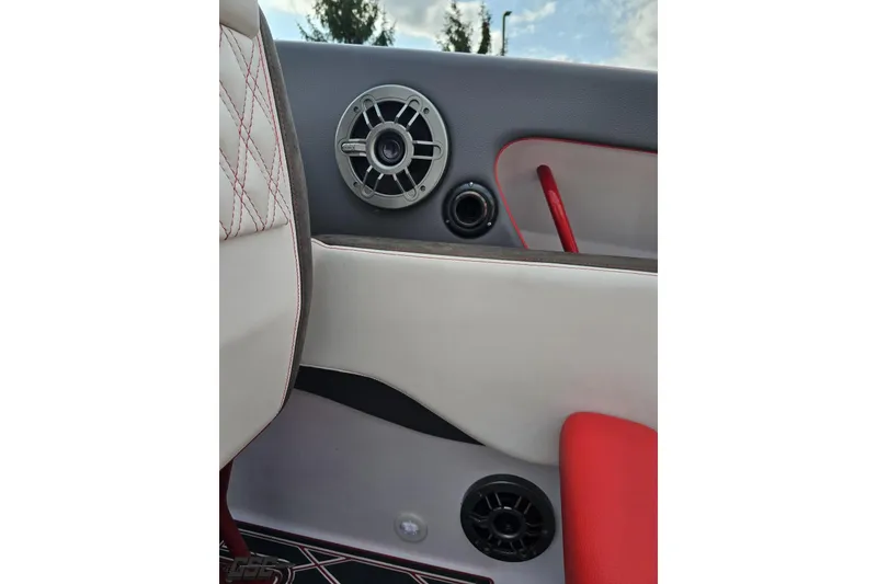 Slide: The Image of Interior of 2008 Donzi 38 ZR boat with speaker and red accents. - 42