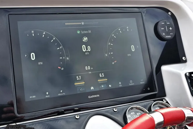 Slide: The Image of Garmin display on 2008 Donzi 38 ZR boat dashboard, showing RPM and speed. - 58