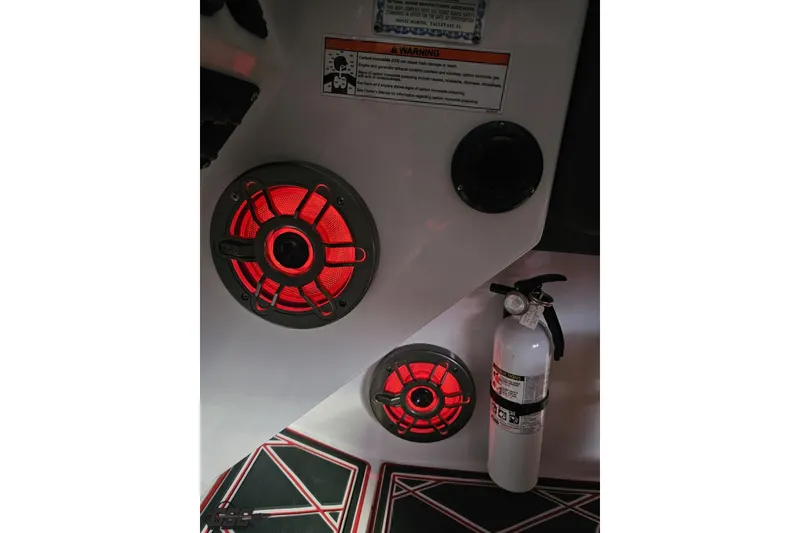 Slide: The Image of 2008 Donzi 38 ZR interior with red-lit speakers and a fire extinguisher. - 60
