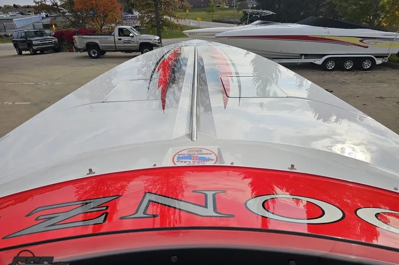 Slide: The Image of 2008 Donzi 38 ZR speedboat with sleek design and vibrant red accents. - 63