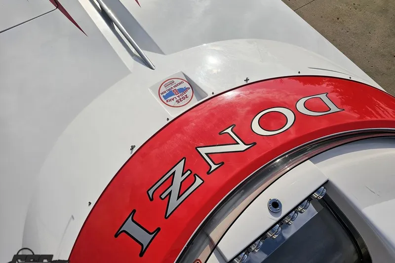 Slide: The Image of 2008 Donzi 38 ZR boat with red detailing and logo on deck. - 65