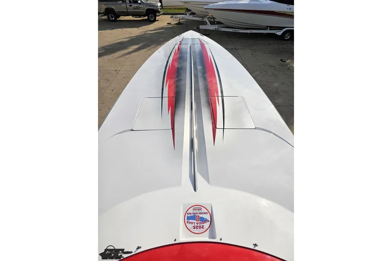 Slide: The Image of 2008 Donzi 38 ZR boat with sleek red and black graphics on deck. - 67