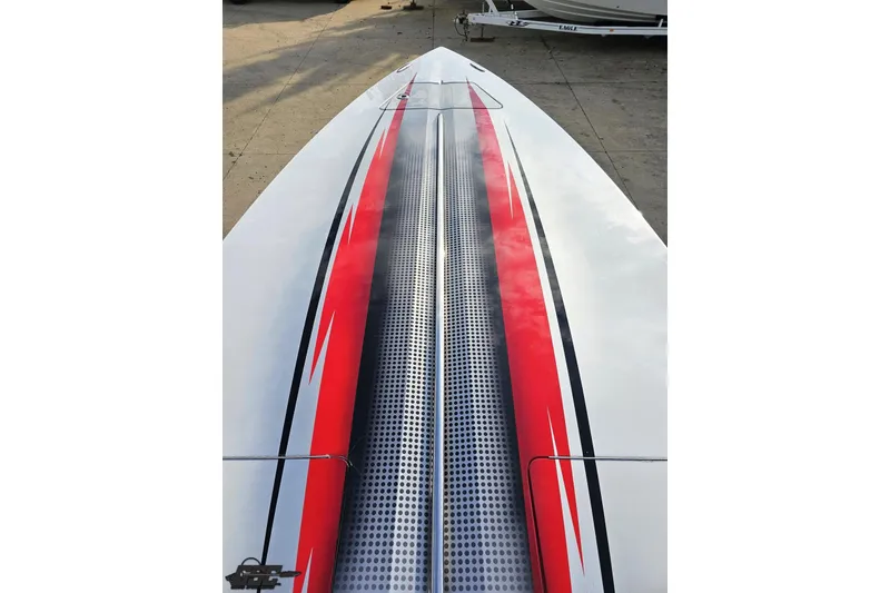 Slide: The Image of 2008 Donzi 38 ZR boat deck with red and black racing stripes. - 68