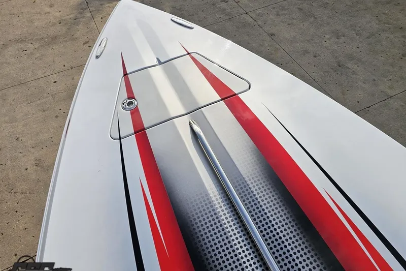 Slide: The Image of 2008 Donzi 38 ZR boat with sleek red and black graphics on white hull. - 69
