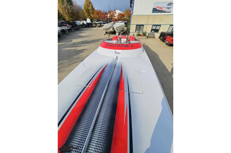 Slide: The Image of 2008 Donzi 38 ZR speedboat with sleek design and vibrant red accents. - 70