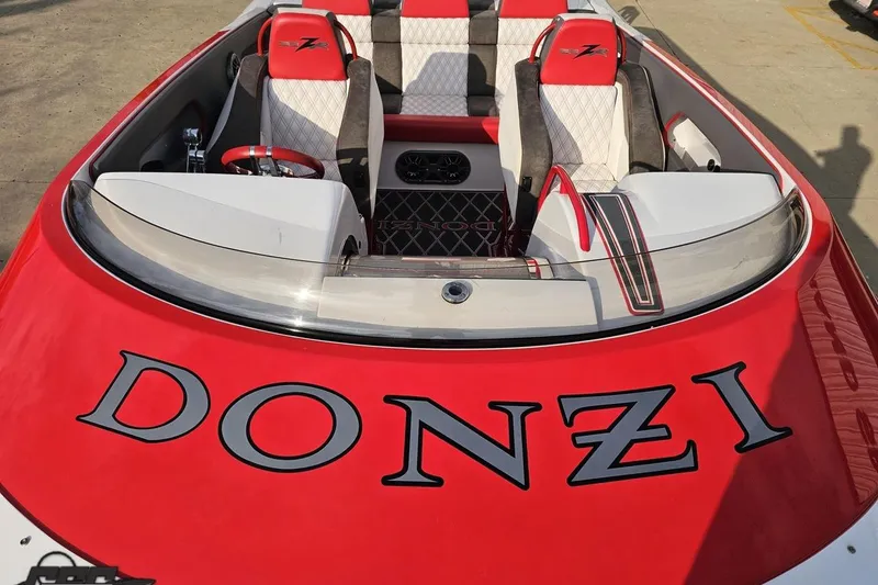 Slide: The Image of 2008 Donzi 38 ZR speedboat with red and white interior, featuring bold "Donzi" branding. - 71