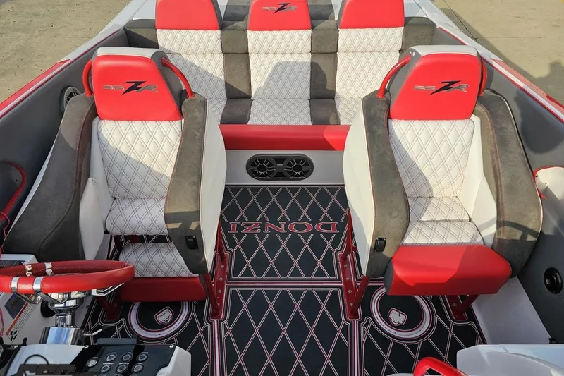 Slide: The Image of 2008 Donzi 38 ZR boat interior with red and white seating, stylish design. - 72