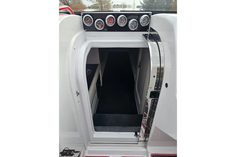 Slide: The Image of 2008 Donzi 38 ZR boat cabin entrance with dashboard gauges. - 73