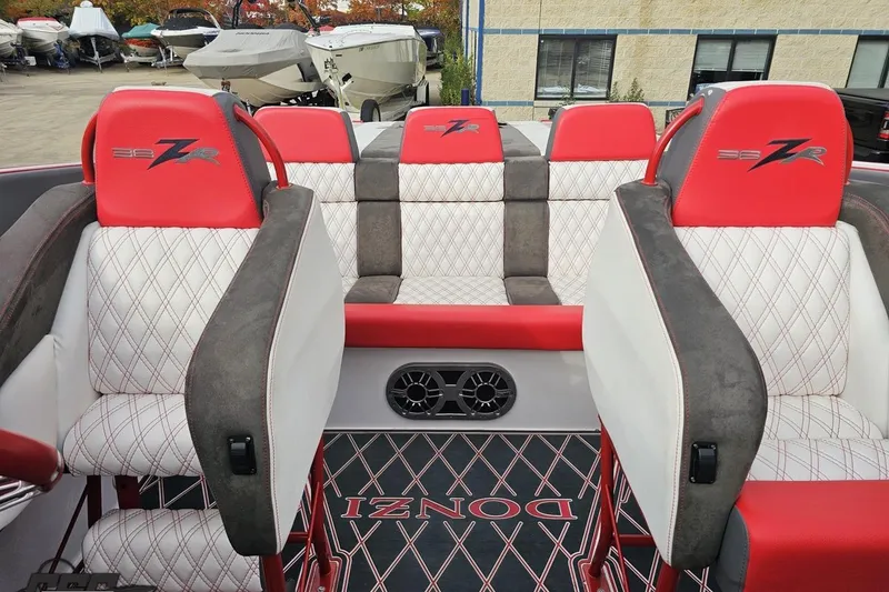 Slide: The Image of 2008 Donzi 38 ZR boat interior with red and white diamond-stitched seats. - 85