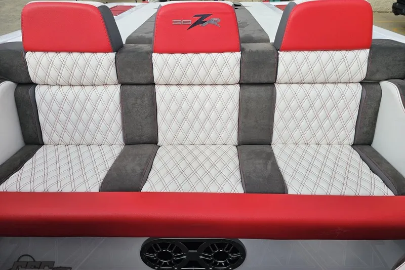 Slide: The Image of Red and white quilted seating on 2008 Donzi 38 ZR boat, featuring stylish design. - 88