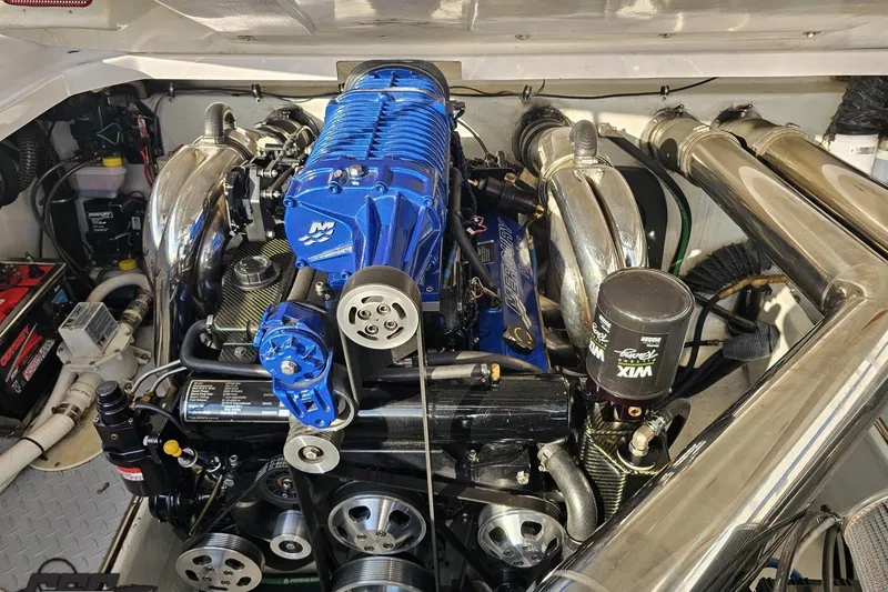 Slide: The Image of Engine compartment of a 2008 Donzi 38 ZR with a powerful blue engine. - 96