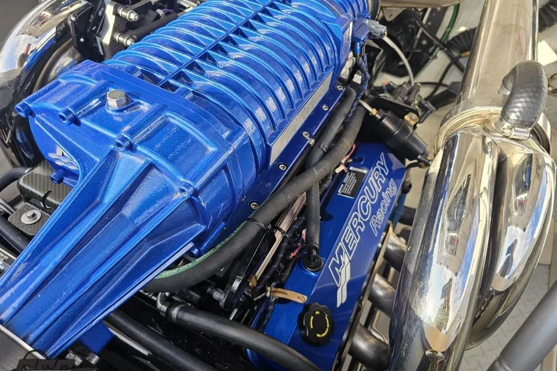 Slide: The Image of Close-up of a 2008 Donzi 38 ZR Mercury Racing engine with blue components. - 99