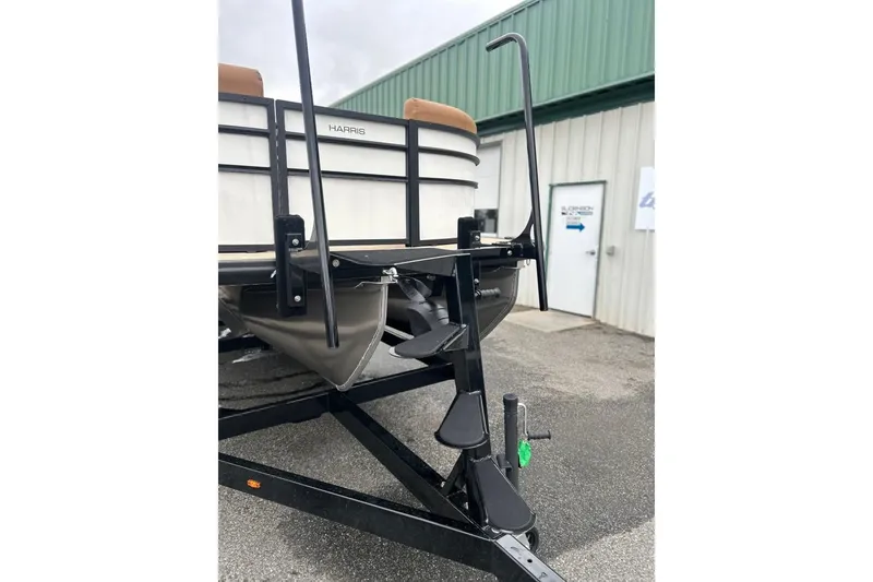 Slide: The Image of 2026 Harris CRUISER 230 SL boat on trailer, featuring rear entry steps. - 14