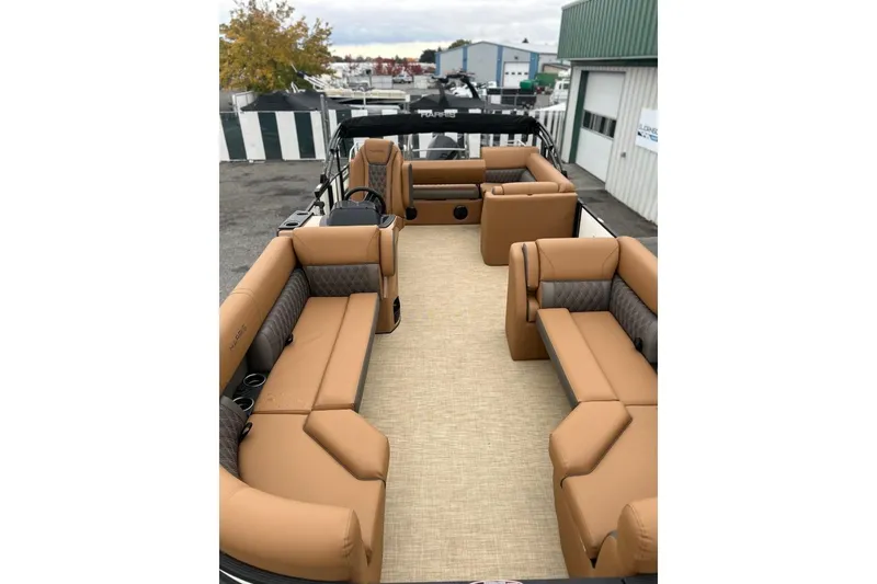 Slide: The Image of 2026 Harris CRUISER 230 SL boat interior with tan seating and spacious layout. - 15