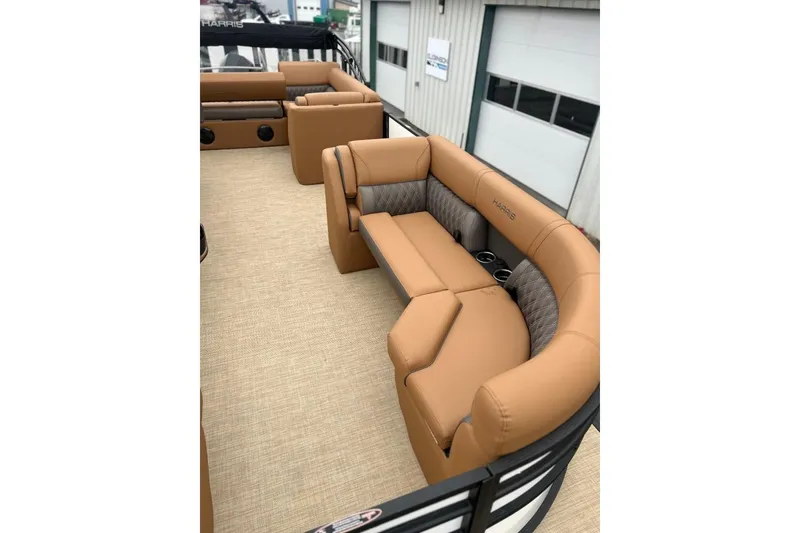 Slide: The Image of Luxurious seating on 2026 Harris CRUISER 230 SL pontoon boat, featuring tan upholstery. - 17
