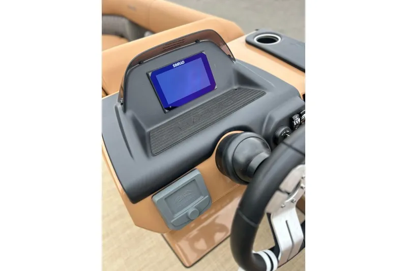 Slide: The Image of 2026 Harris CRUISER 230 SL dashboard with Simrad display and steering wheel. - 21