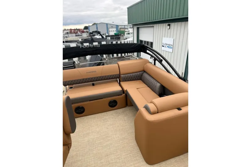 Slide: The Image of 2026 Harris CRUISER 230 SL boat interior with tan seating and modern design. - 26