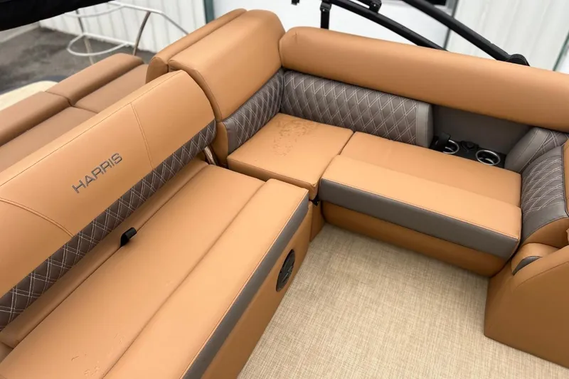 Slide: The Image of Luxurious seating on 2026 Harris CRUISER 230 SL boat, featuring tan and gray upholstery. - 29