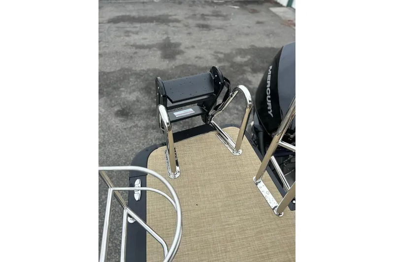 Slide: The Image of 2026 Harris CRUISER 230 SL boat with Mercury engine and swim ladder. - 31