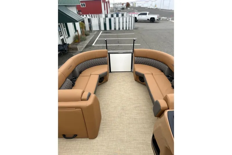Slide: The Image of Luxurious interior of 2026 Harris CRUISER 230 SL pontoon boat with tan seating. - 39