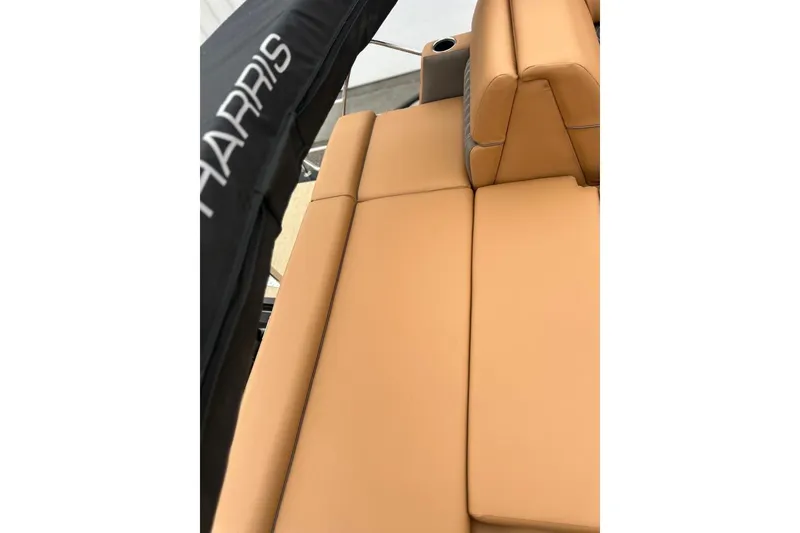 Slide: The Image of Luxurious tan seating on 2026 Harris CRUISER 230 SL boat, featuring sleek design and comfort. - 41