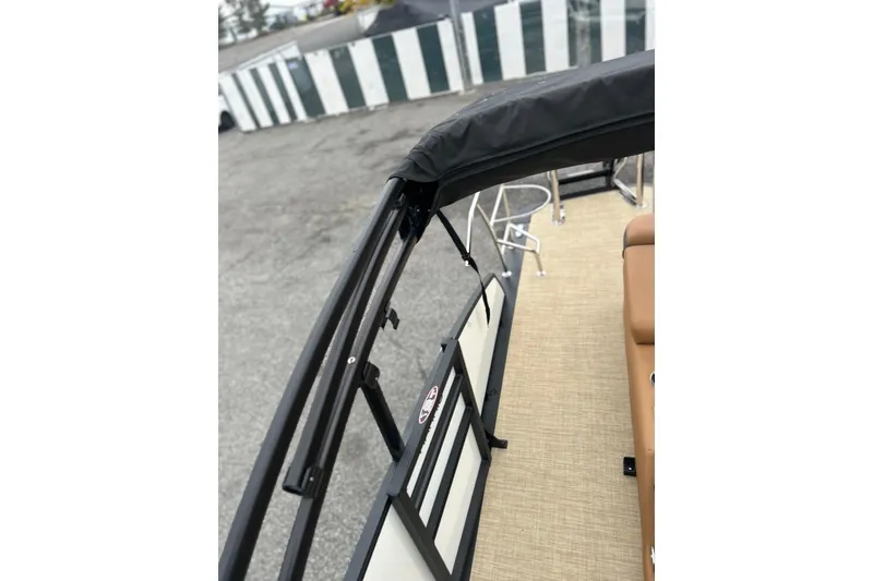 Slide: The Image of 2026 Harris CRUISER 230 SL boat interior with tan seating and black railing. - 42