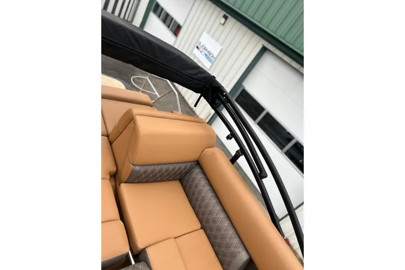 Slide: The Image of Luxurious seating on 2026 Harris CRUISER 230 SL boat, featuring tan and patterned upholstery. - 43