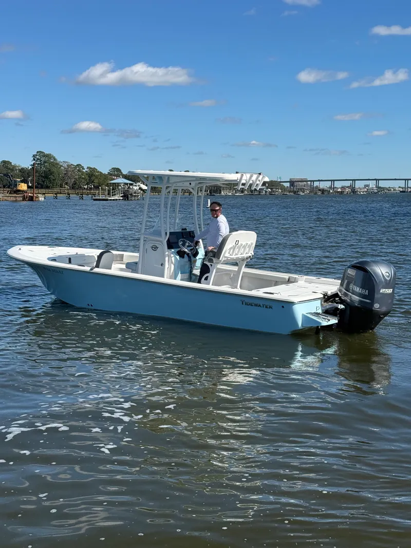 Slide: The Image of 2020 Tidewater 2300 Carolina Bay boat on water with clear sky background. - 10