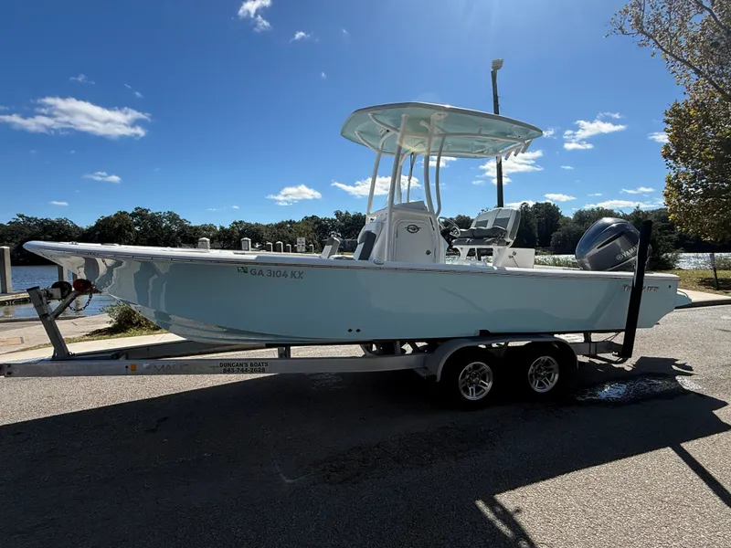Slide: The Image of 2020 Tidewater 2300 Carolina Bay boat on trailer under clear blue sky. - 26